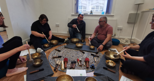 a singing bowl training session taking place